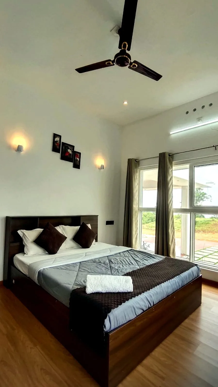Bedroom with large windows looking out to the grounds