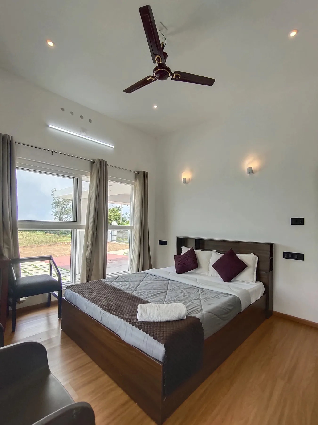 Bedroom with window and armchair