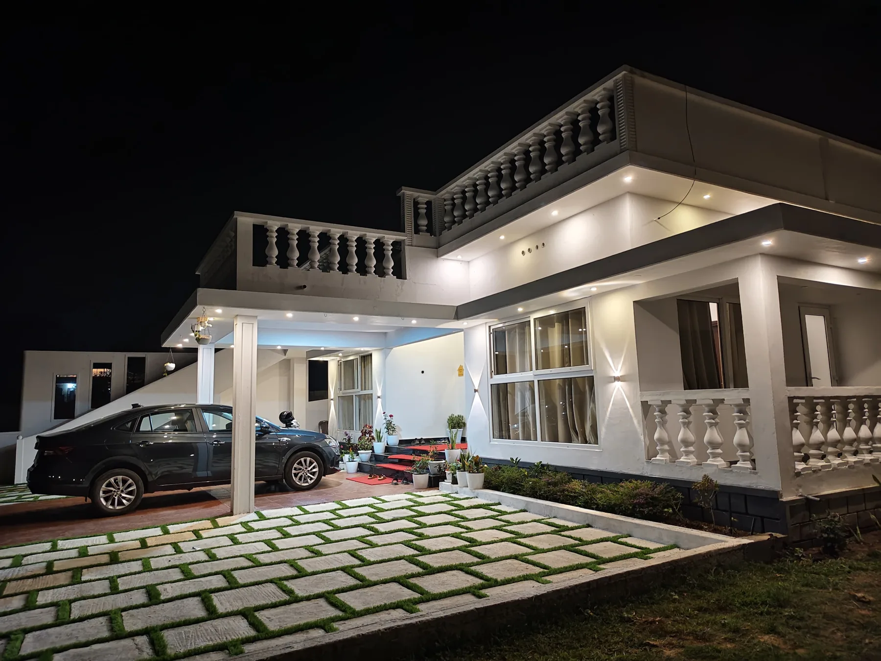 Villa porch and driveway at night